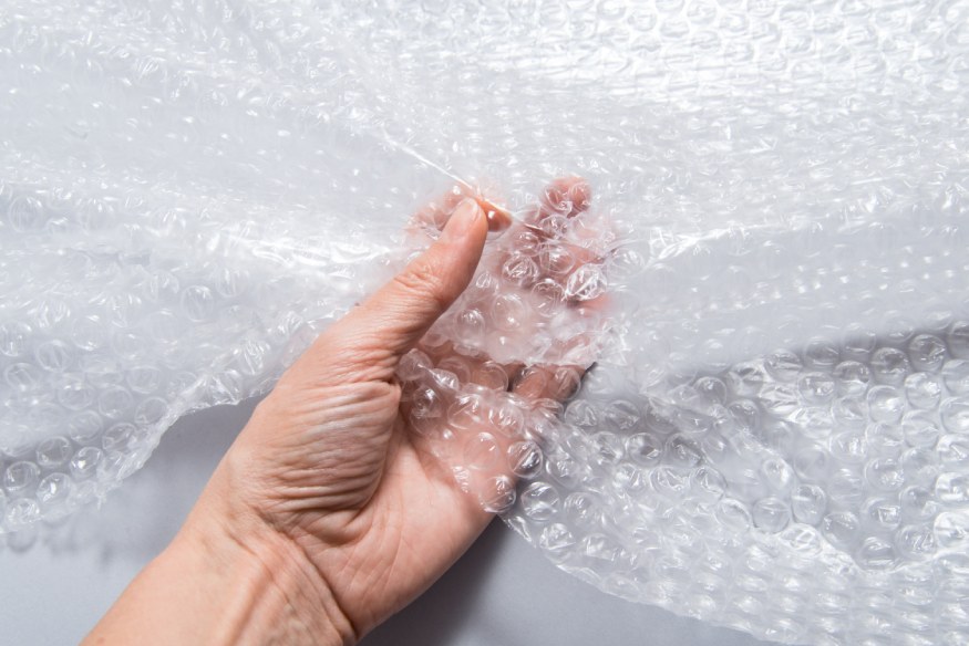 a hand holding a bubble wrap