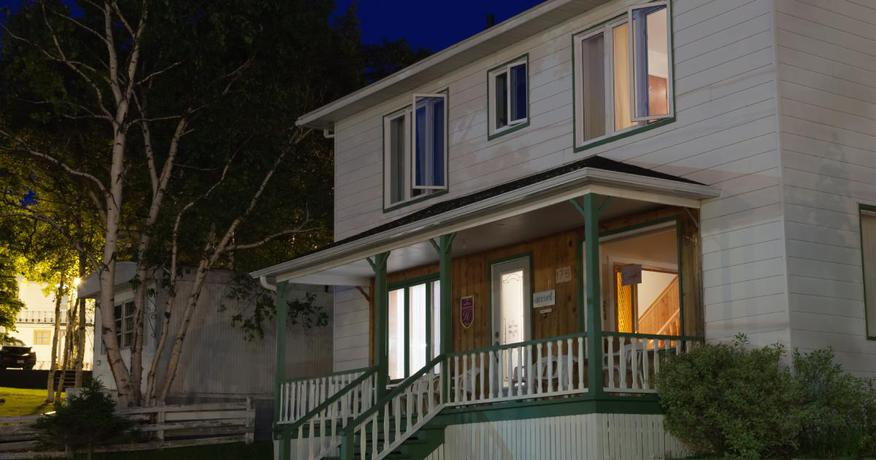 A residential home with the windows open