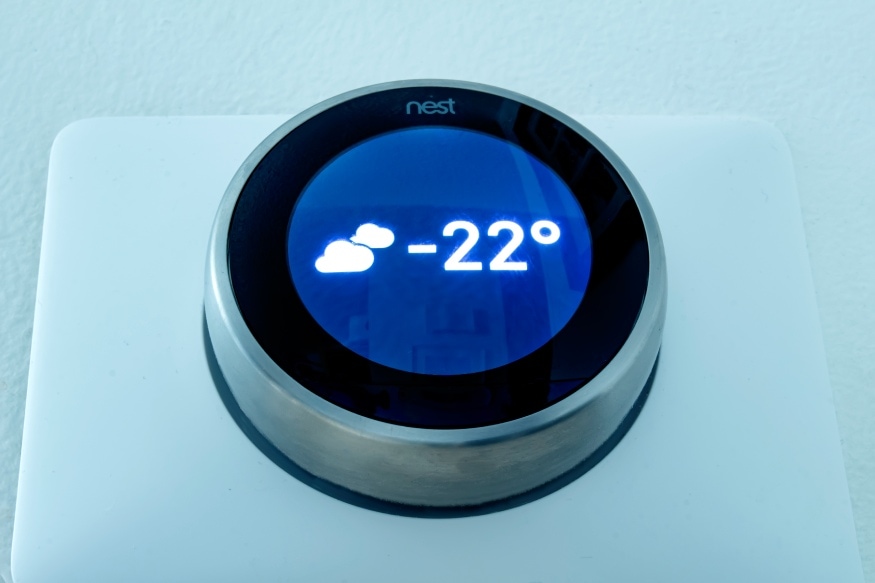 a thermostat displaying the thermostat at night